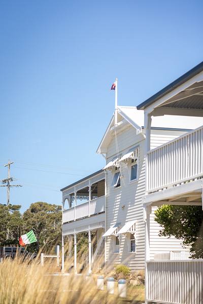 Guest house with Australian and Italian flags