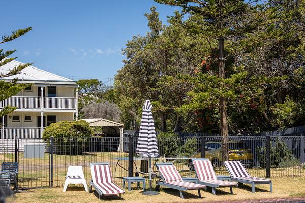 Poolside relaxation with motel wing in background