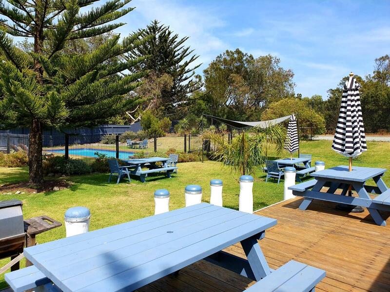 Spacious grounds with BBQ area, picnic tables and pool